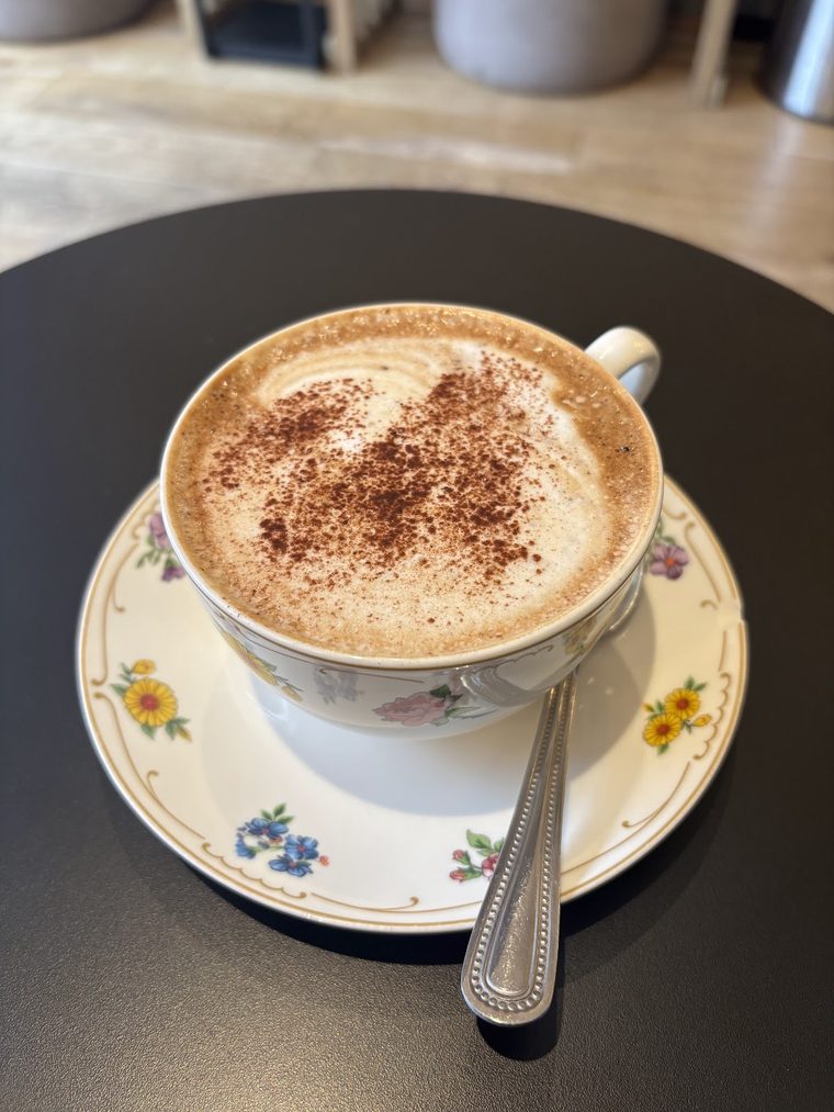 Cappuccino in a vintage floral cup